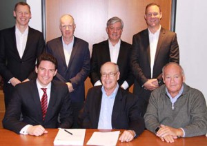 The PEP and Manuka Health teams sign the agreement.